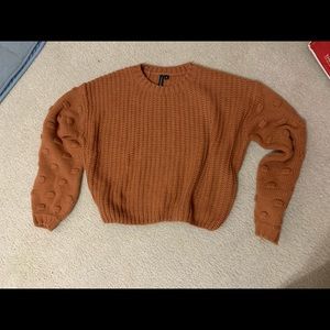 Cropped sweater with beautiful sleeve detail!